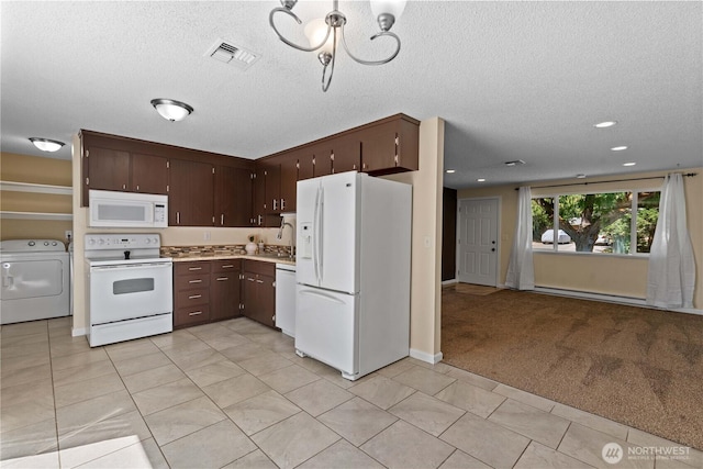1315 Gaspar St, Wenatchee, WA 98801 - kitchen featuring white appliances, washer / clothes dryer, a chandelier, light countertops, and dark brown cabinets