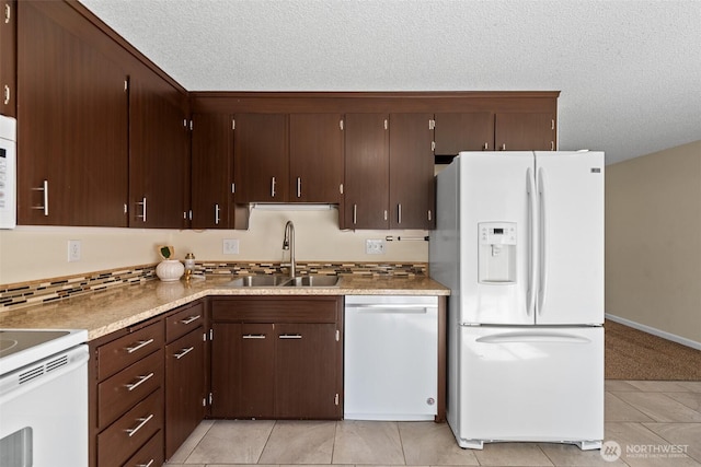 1315 Gaspar St, Wenatchee, WA 98801 - kitchen with white appliances, decorative backsplash, a textured ceiling, light tile patterned floors, and dark brown cabinets