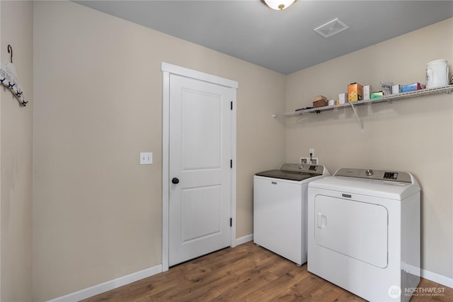 9321 179th Ln SW, Rochester, WA 98579 - washroom with washing machine and clothes dryer and wood finished floors
