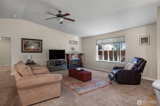 9321 179th Ln SW, Rochester, WA 98579 - living room with lofted ceiling, ceiling fan, carpet floors, and a glass covered fireplace