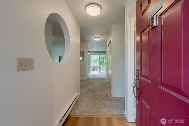 22703 Lakeview Dr Unit E5, Mountlake Terrace, WA 98043 - hall featuring a baseboard radiator, light wood finished floors, and light carpet