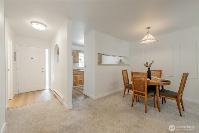 22703 Lakeview Dr Unit E5, Mountlake Terrace, WA 98043 - carpeted dining space with a baseboard heating unit and baseboards