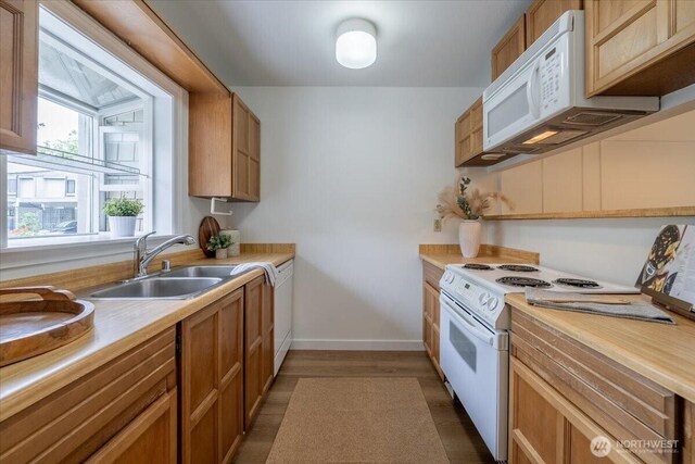 22703 Lakeview Dr Unit E5, Mountlake Terrace, WA 98043 - kitchen with white appliances, light countertops, and wood finished floors