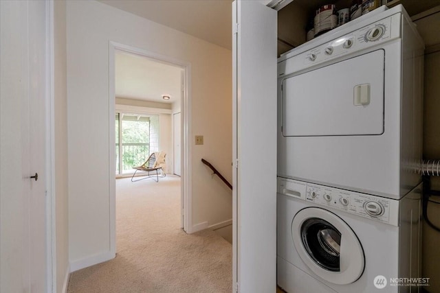 22703 Lakeview Dr Unit E5, Mountlake Terrace, WA 98043 - washroom with stacked washing machine and dryer and light colored carpet