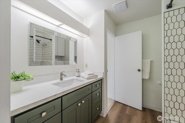 22703 Lakeview Dr Unit E5, Mountlake Terrace, WA 98043 - full bathroom with vanity, a tile shower, and wood finished floors
