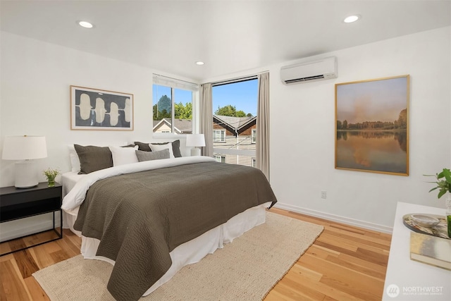 6042B 41st Ave SW, Seattle, WA 98136 - bedroom featuring a wall mounted AC, wood finished floors, and recessed lighting
