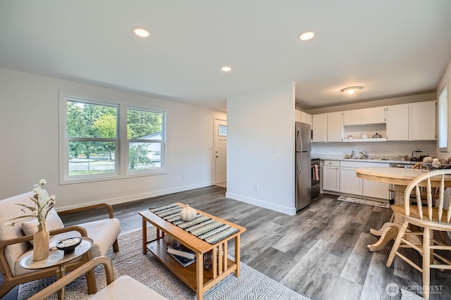 10985 SE 225th St, Kent, WA 98031 - living room featuring dark wood finished floors and recessed lighting
