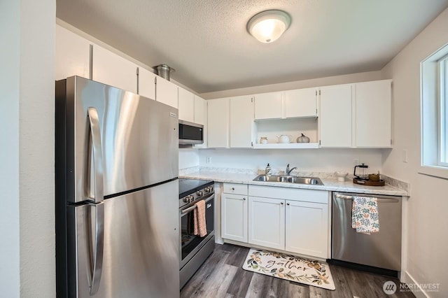 10985 SE 225th St, Kent, WA 98031 - kitchen with stainless steel appliances, open shelves, white cabinets, and dark wood-style flooring