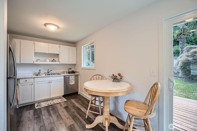 10985 SE 225th St, Kent, WA 98031 - kitchen featuring appliances with stainless steel finishes, white cabinetry, open shelves, and light countertops