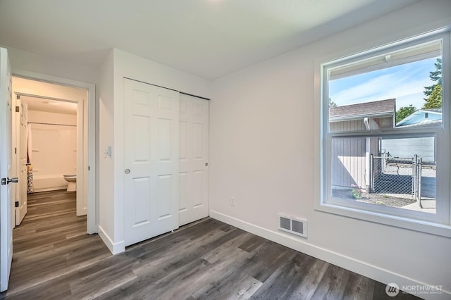 10985 SE 225th St, Kent, WA 98031 - unfurnished bedroom featuring dark wood-type flooring and a closet