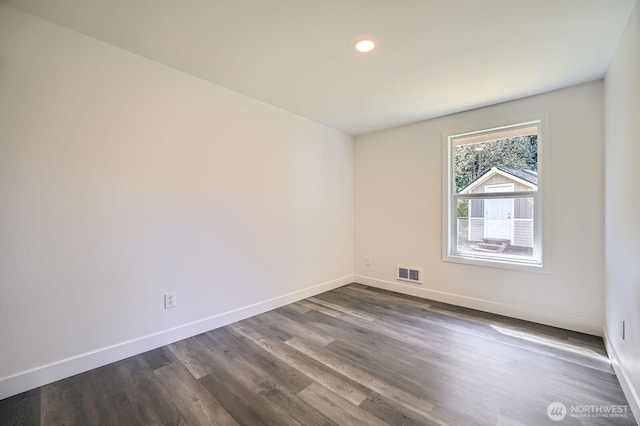 10985 SE 225th St, Kent, WA 98031 - empty room with dark wood finished floors and recessed lighting