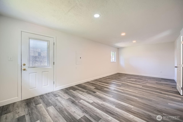 10985 SE 225th St, Kent, WA 98031 - entryway featuring dark wood finished floors, a textured ceiling, and recessed lighting