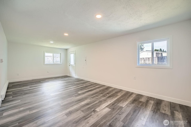 10985 SE 225th St, Kent, WA 98031 - spare room featuring recessed lighting, dark wood-style flooring, and a textured ceiling
