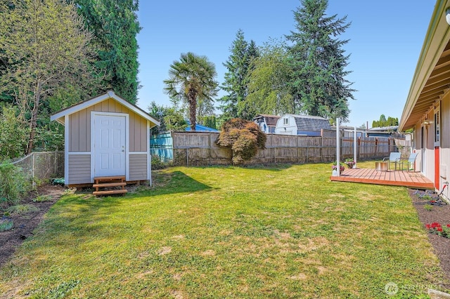 10985 SE 225th St, Kent, WA 98031 - fenced backyard with a wooden deck and a shed