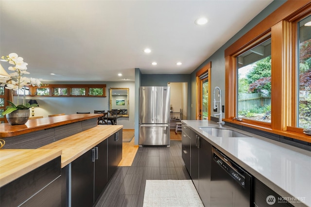 1201 Wilson St, Port Townsend, WA 98368 - kitchen with freestanding refrigerator, wood counters, dishwasher, healthy amount of natural light, and recessed lighting