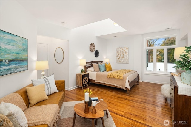 28091/2 Mount Rainier Dr S Unit 3, Seattle, WA 98144 - bedroom featuring a skylight and wood finished floors