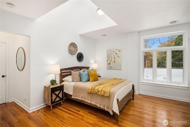 28091/2 Mount Rainier Dr S Unit 3, Seattle, WA 98144 - bedroom with baseboards and wood finished floors