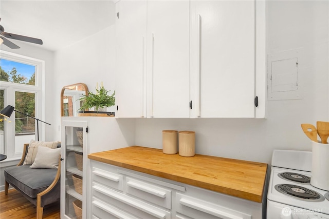 28091/2 Mount Rainier Dr S Unit 3, Seattle, WA 98144 - kitchen with wood counters, white cabinetry, range, ceiling fan, and wood finished floors