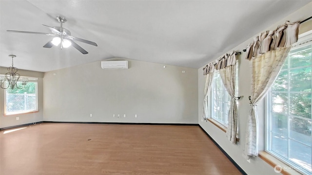 24250 164th Ave SE, Kent, WA 98042 - unfurnished room with wood finished floors, lofted ceiling, ceiling fan, and a wall mounted AC
