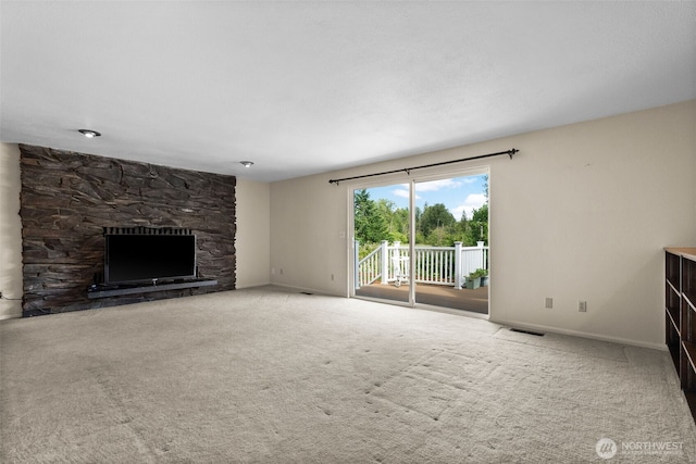 12012 County Line Rd E, Edgewood, WA 98372 - unfurnished living room with a fireplace and carpet