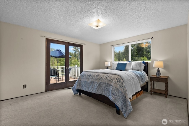 12012 County Line Rd E, Edgewood, WA 98372 - carpeted bedroom with access to exterior, multiple windows, a textured ceiling, and french doors