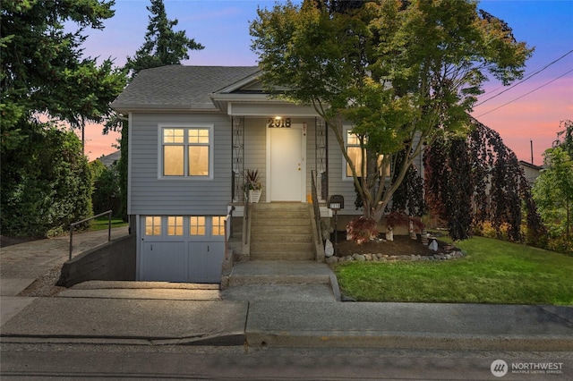 2318 F St, Bellingham, WA 98225 - view of front of house with a front yard, roof with shingles, and covered porch