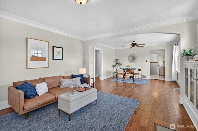 2318 F St, Bellingham, WA 98225 - living area with arched walkways, crown molding, wood finished floors, and ceiling fan