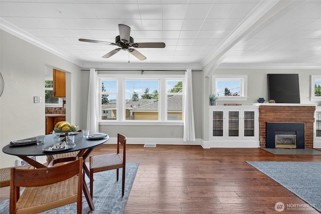 2318 F St, Bellingham, WA 98225 - dining area featuring ornamental molding, hardwood / wood-style floors, plenty of natural light, a brick fireplace, and ceiling fan