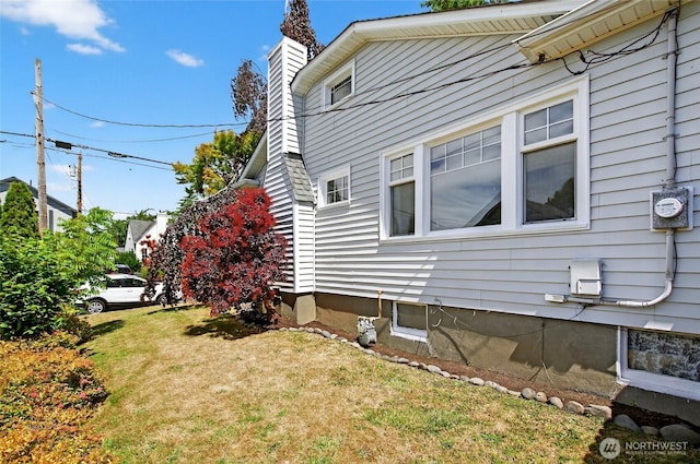 2318 F St, Bellingham, WA 98225 - view of home's exterior featuring a chimney and a lawn