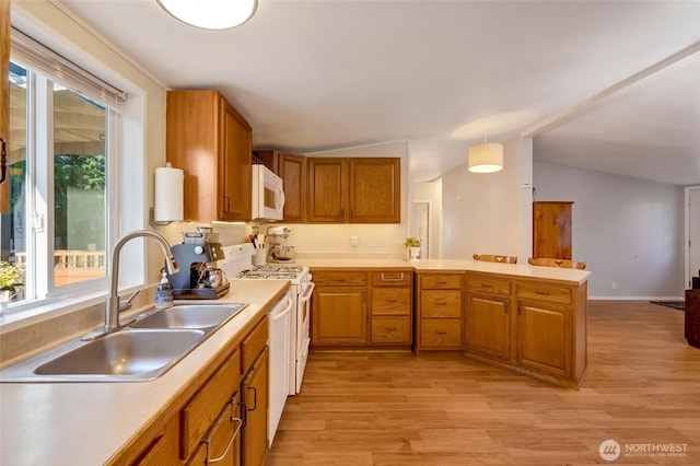 24442 Wicker Rd Unit 37, Sedro Woolley, WA 98284 - kitchen featuring white appliances, light countertops, light wood-style floors, plenty of natural light, and lofted ceiling