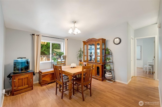 24442 Wicker Rd Unit 37, Sedro Woolley, WA 98284 - dining area with a chandelier, light wood-style floors, and vaulted ceiling