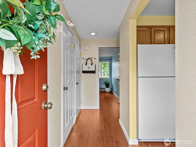 4811 76th St NE Unit 5, Marysville, WA 98270 - entrance foyer with wood finished floors and a textured ceiling