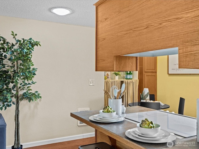 4811 76th St NE Unit 5, Marysville, WA 98270 - dining room with wood finished floors and a textured ceiling
