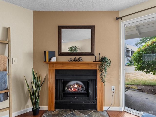 4811 76th St NE Unit 5, Marysville, WA 98270 - detailed view of baseboards and a warm lit fireplace
