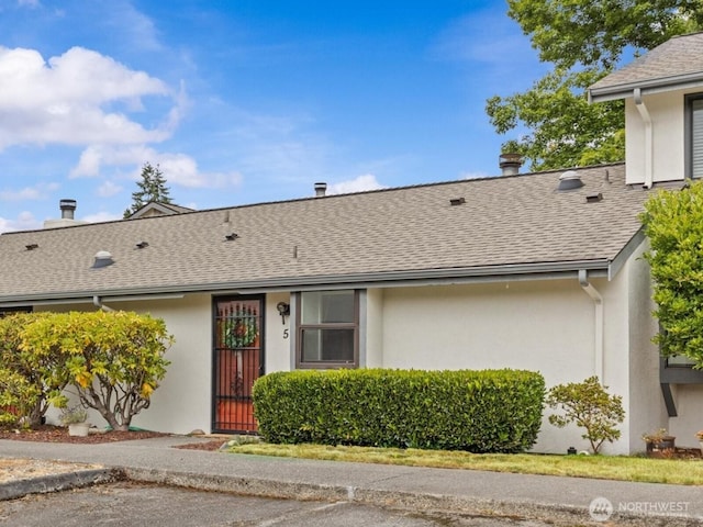 4811 76th St NE Unit 5, Marysville, WA 98270 - view of front of house featuring stucco siding and roof with shingles
