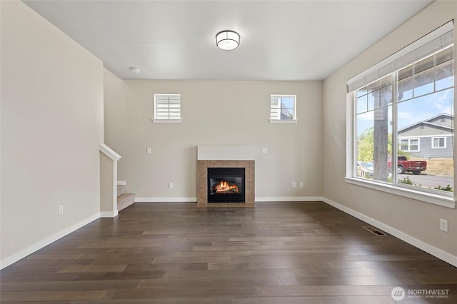 329 Holland Ave, Bellingham, WA 98226 - unfurnished living room featuring healthy amount of natural light, dark wood finished floors, and a fireplace