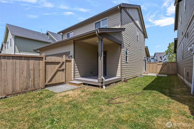 329 Holland Ave, Bellingham, WA 98226 - back of house with a gate, a fenced backyard, and a wooden deck