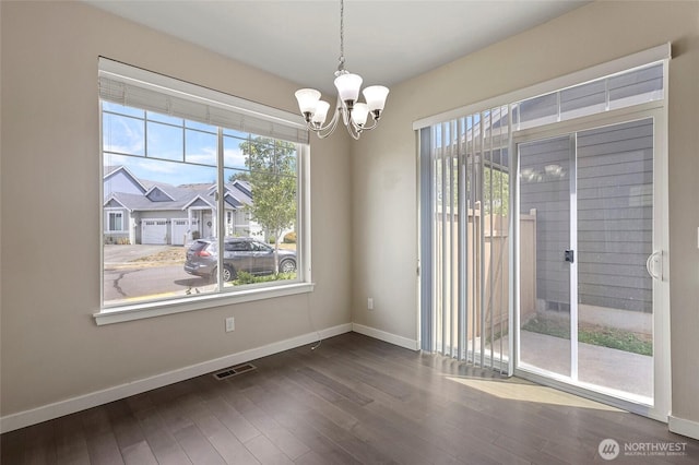 329 Holland Ave, Bellingham, WA 98226 - spare room with plenty of natural light, a chandelier, and dark wood-style flooring