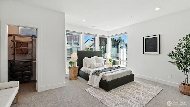 9608 NE 182nd Ct Unit D, Bothell, WA 98011 - carpeted bedroom with a walk in closet and recessed lighting