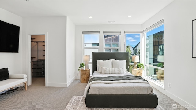 9608 NE 182nd Ct Unit D, Bothell, WA 98011 - bedroom featuring carpet flooring, multiple windows, a spacious closet, and recessed lighting