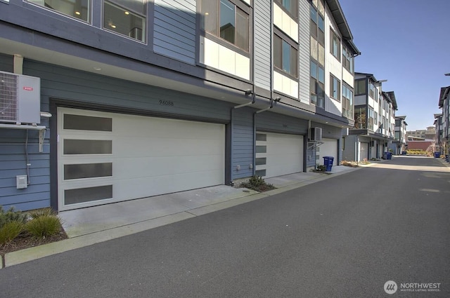 9608 NE 182nd Ct Unit D, Bothell, WA 98011 - view of property with a garage, a residential view, and driveway