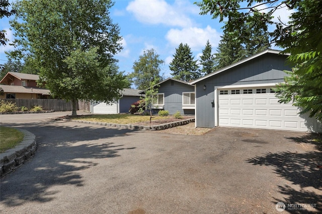 11636 25th Ave SE, Olympia, WA 98513 - ranch-style house with asphalt driveway and a garage