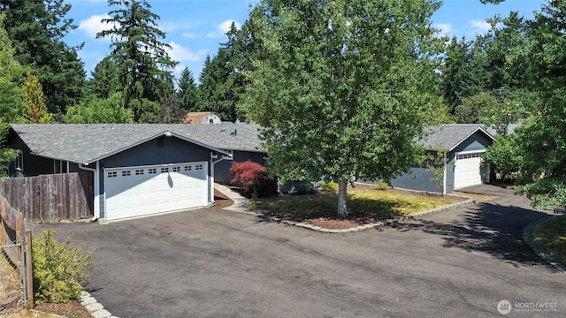 11636 25th Ave SE, Olympia, WA 98513 - view of front of house featuring driveway, roof with shingles, and an attached garage
