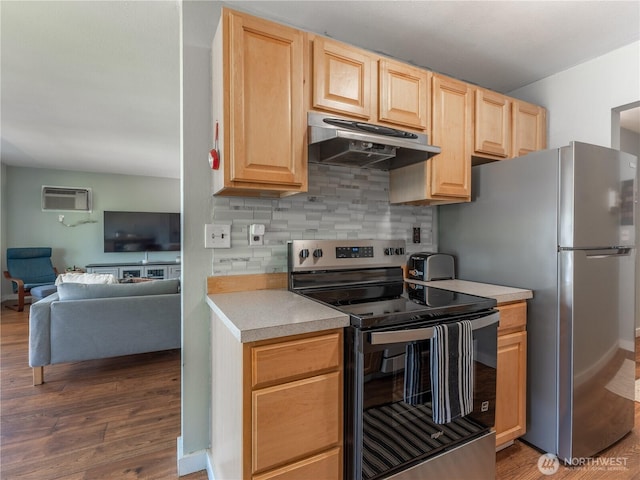 10 S Cove Ave Unit 21, Wenatchee, WA 98801 - kitchen featuring stainless steel appliances, under cabinet range hood, light brown cabinets, wood finished floors, and open floor plan