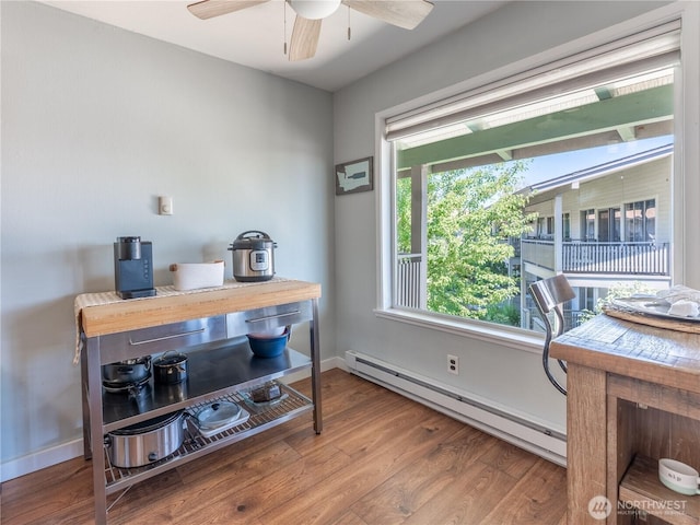10 S Cove Ave Unit 21, Wenatchee, WA 98801 - office area with a baseboard heating unit, ceiling fan, and wood finished floors