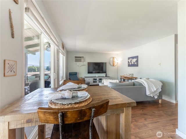10 S Cove Ave Unit 21, Wenatchee, WA 98801 - dining area featuring wood finished floors and a wall mounted air conditioner
