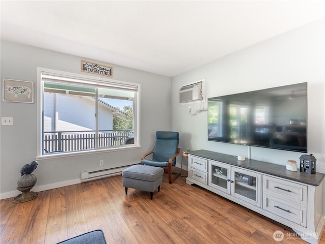 10 S Cove Ave Unit 21, Wenatchee, WA 98801 - living area featuring baseboard heating, a wall mounted air conditioner, and wood finished floors