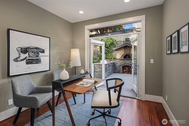 2542 12th Ave W, Seattle, WA 98119 - office with a fireplace, wood finished floors, and recessed lighting