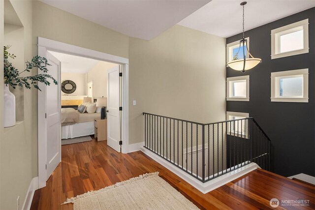 2542 12th Ave W, Seattle, WA 98119 - hallway featuring an upstairs landing and wood finished floors