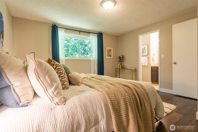 1638 Index Ave SE, Renton, WA 98058 - bedroom with wood finished floors, a textured ceiling, and connected bathroom